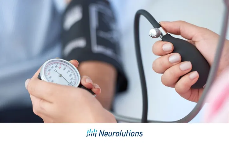 nurse taking patient's blood pressure