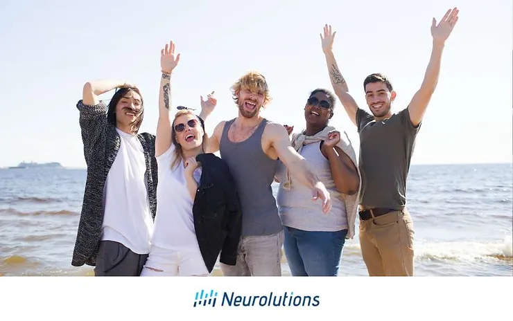 group of young adults having a good time at the beach